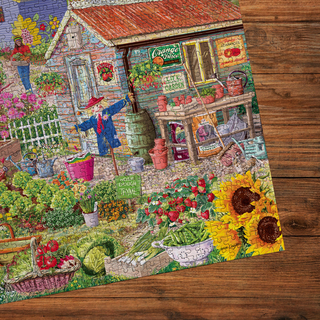 Colorful garden scene with a small shed, plants, and flowers on a wooden surface