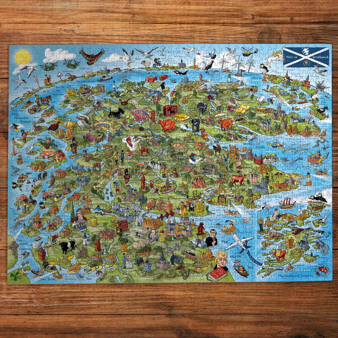 Detailed map of Scotland with illustrations on a wooden surface
