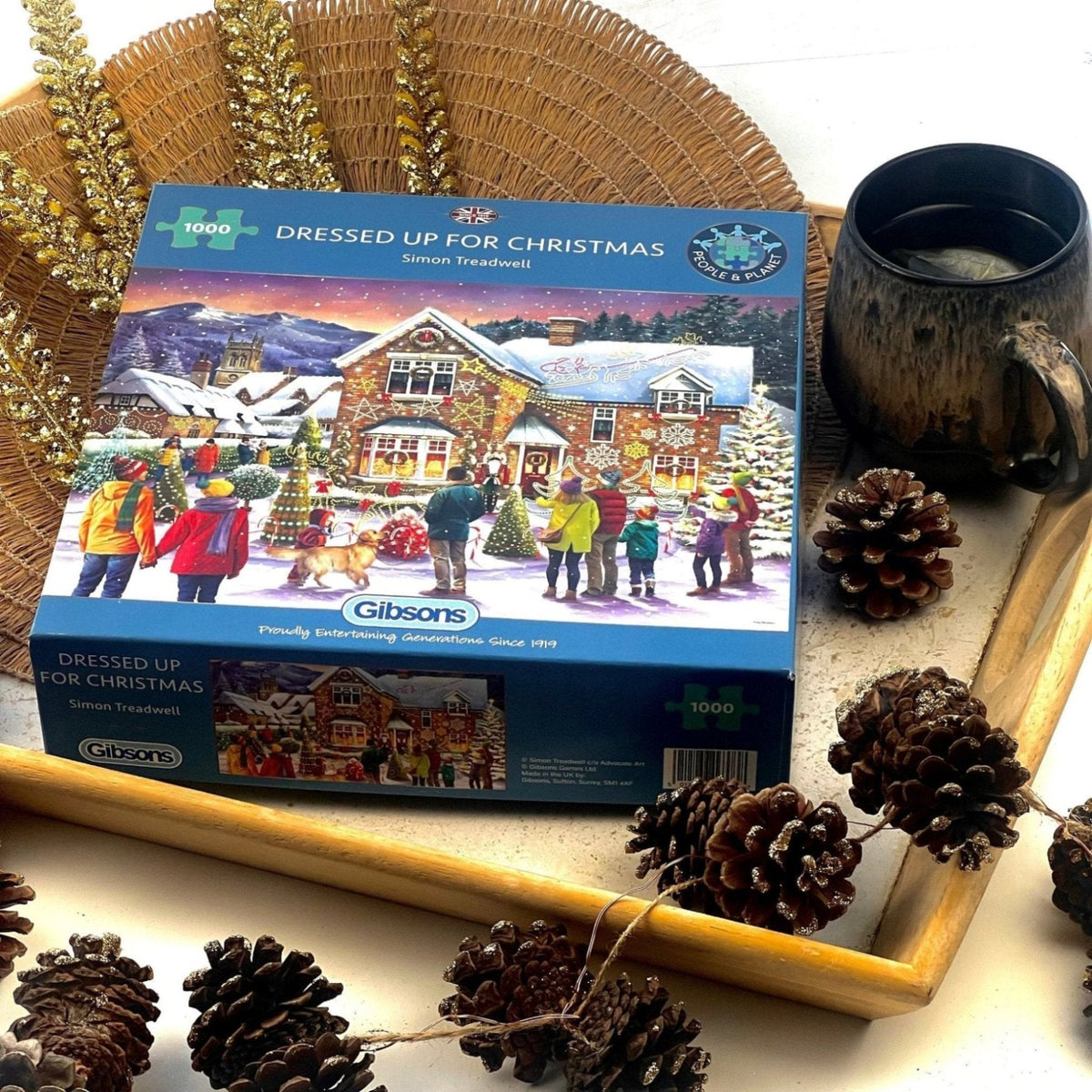 Gibsons Dressed Up for Christmas  1000 Piece Jigsaw  puzzle placed on the tray with cones and tea