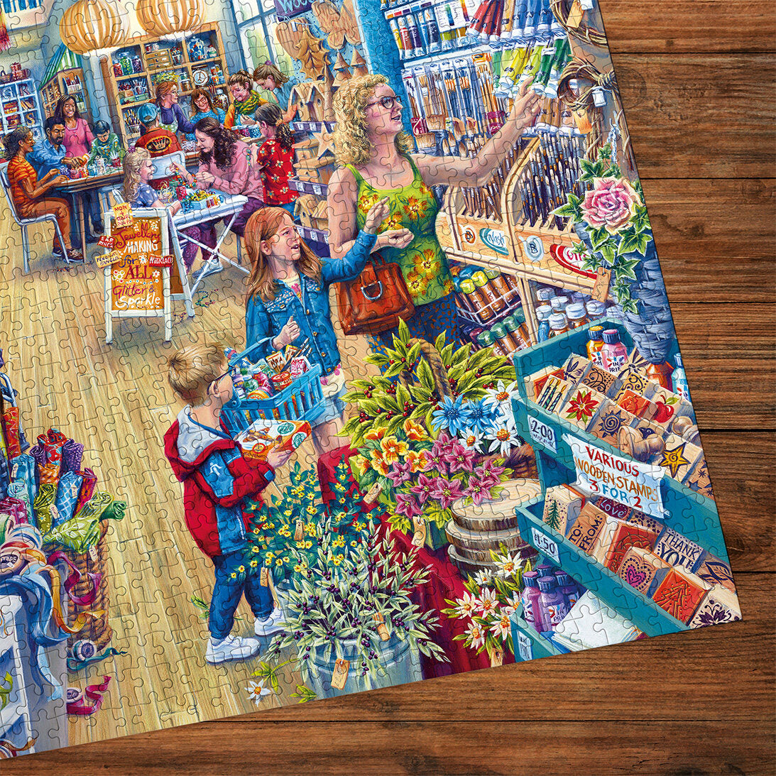 Gibsons Crafter's Paradise 1000 Piece Jigsaw Puzzle made up detail on wooden table