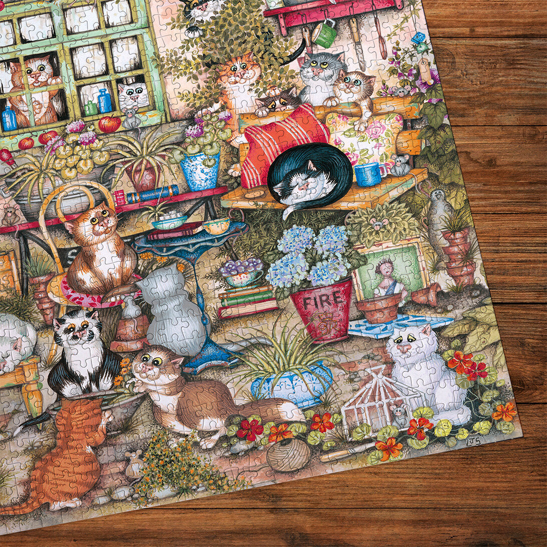 Gibsons Courtyard Cats 1000 Piece Jigsaw Puzzle made up detail on wooden table