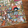Gibsons Courtyard Cats 1000 Piece Jigsaw Puzzle made up detail on wooden table