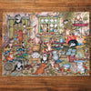Gibsons Courtyard Cats 1000 Piece Jigsaw Puzzle made up on wooden table