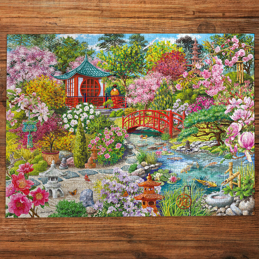 Gibsons The Japanese Garden 1000 Piece Jigsaw Puzzle made up on wooden table