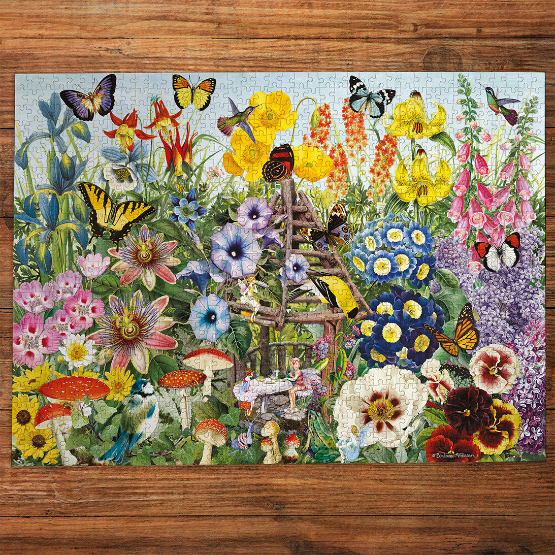Gibsons Fairy Garden 1000 Piece Jigsaw Puzzle made up on wooden table