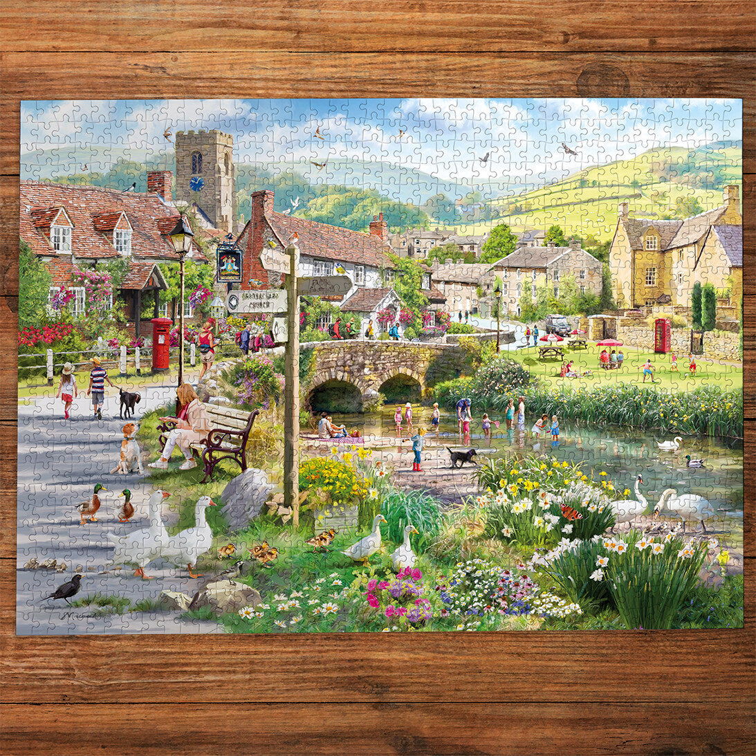 Ducks & Paddling 1000 Piece Jigsaw Puzzle by Gibsons made up on wooden table