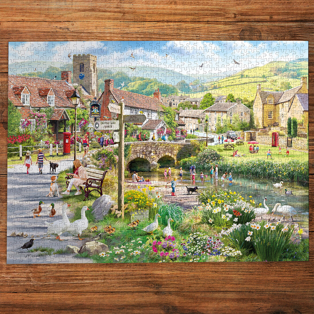 Ducks & Paddling 1000 Piece Jigsaw Puzzle by Gibsons made up on wooden table