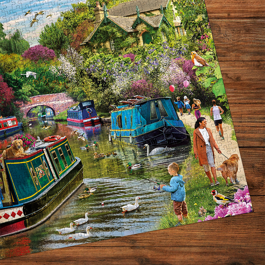 Gibsons River Retreat 1000 Piece Jigsaw Puzzle made up detail on wooden table