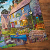 Gibsons Tea on the river 1000 piece jigsaw puzzle for Adults made up detail on wooden table