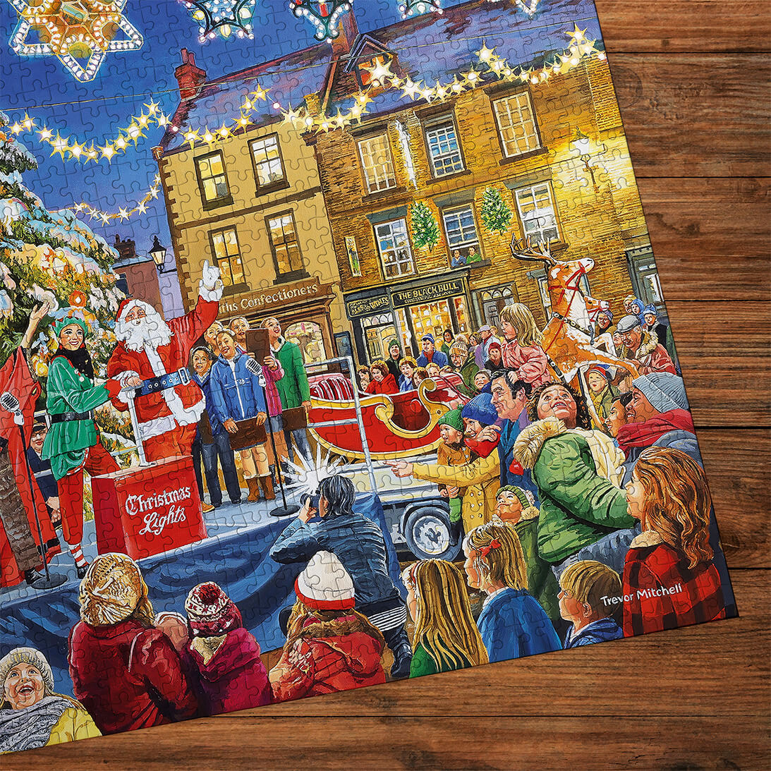 Gibsons Christmas Switch On 1000 Piece Jigsaw Puzzle for Adults made detail up on wooden table