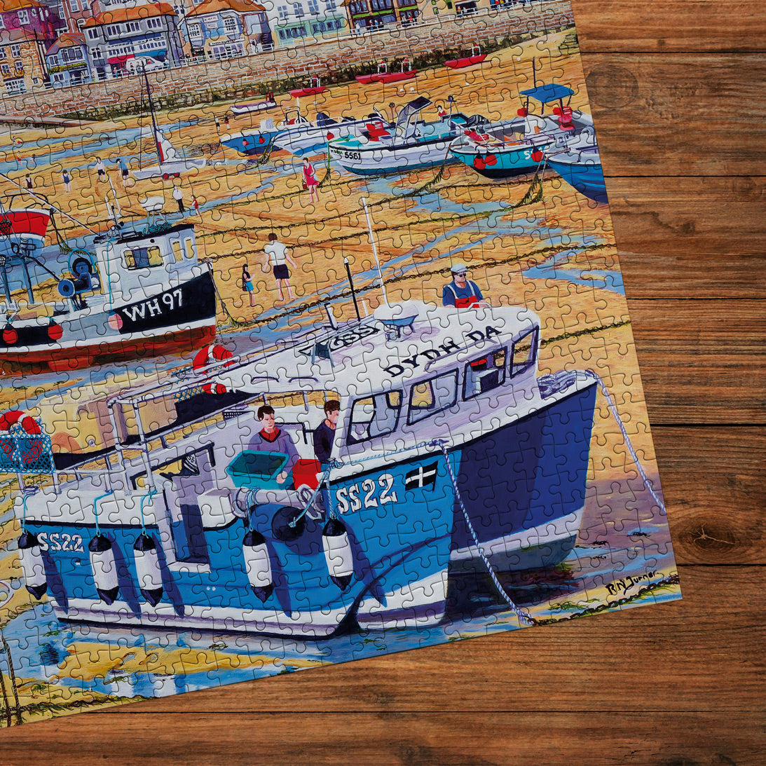 Jigsaw puzzle with a boat design on a wooden surface