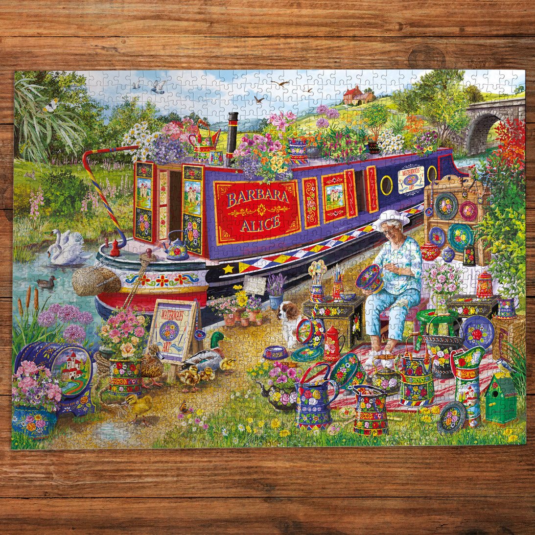 Colorful puzzle with a scenic design featuring a boat and a person on a wooden surface.