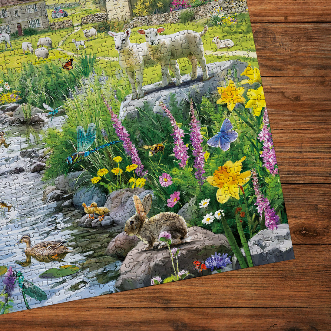 Jigsaw puzzle with a completed scene of animals and nature on a wooden surface