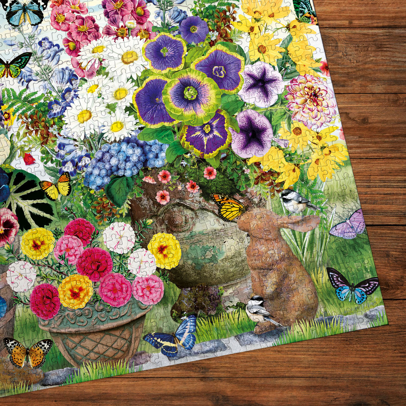 Colorful garden-themed placemat with flowers, butterflies, and a rabbit on a wooden surface.