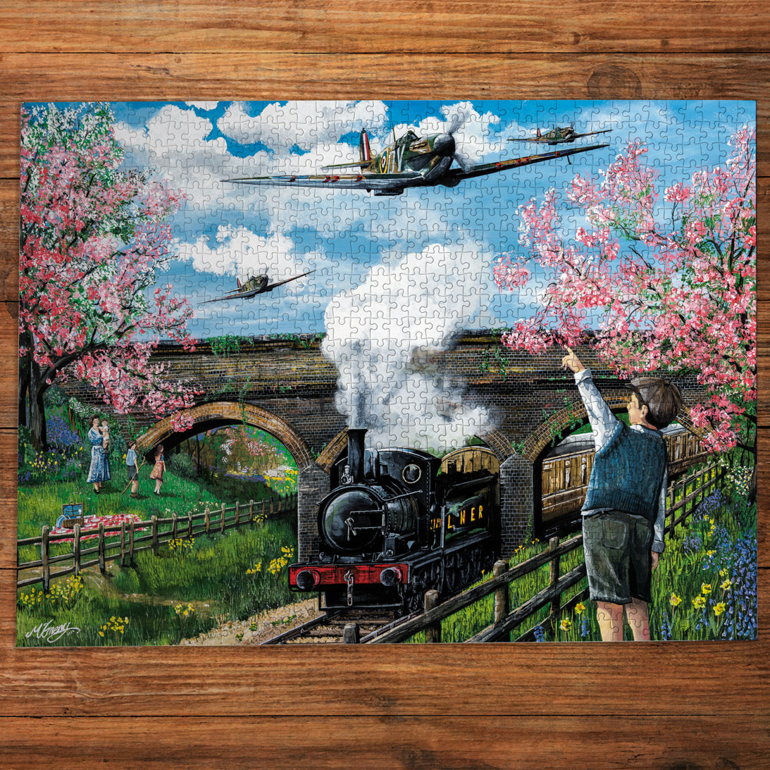 Jigsaw puzzle with a scenic design of a steam train and cherry blossoms on a wooden surface