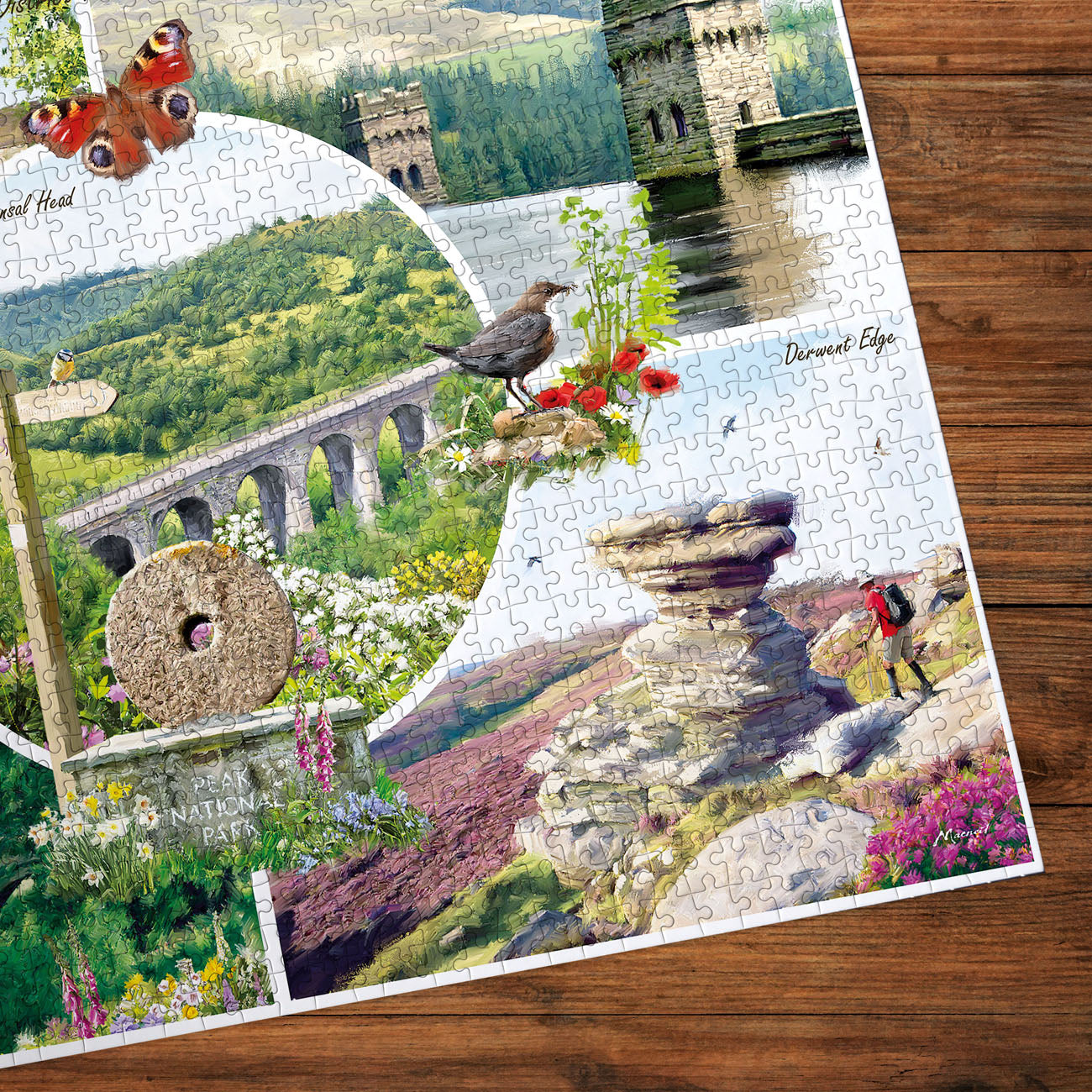 Gibsons puzzle featuring images of the Peak District on wooden table