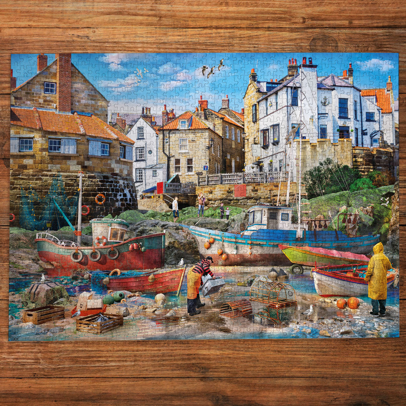 Jigsaw puzzle of a coastal scene with boats and buildings on a wooden frame