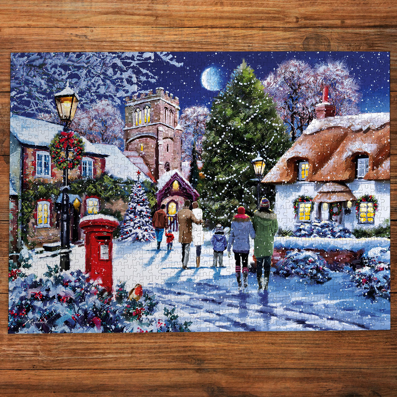 Christmas-themed puzzle with a snowy village scene on a wooden surface