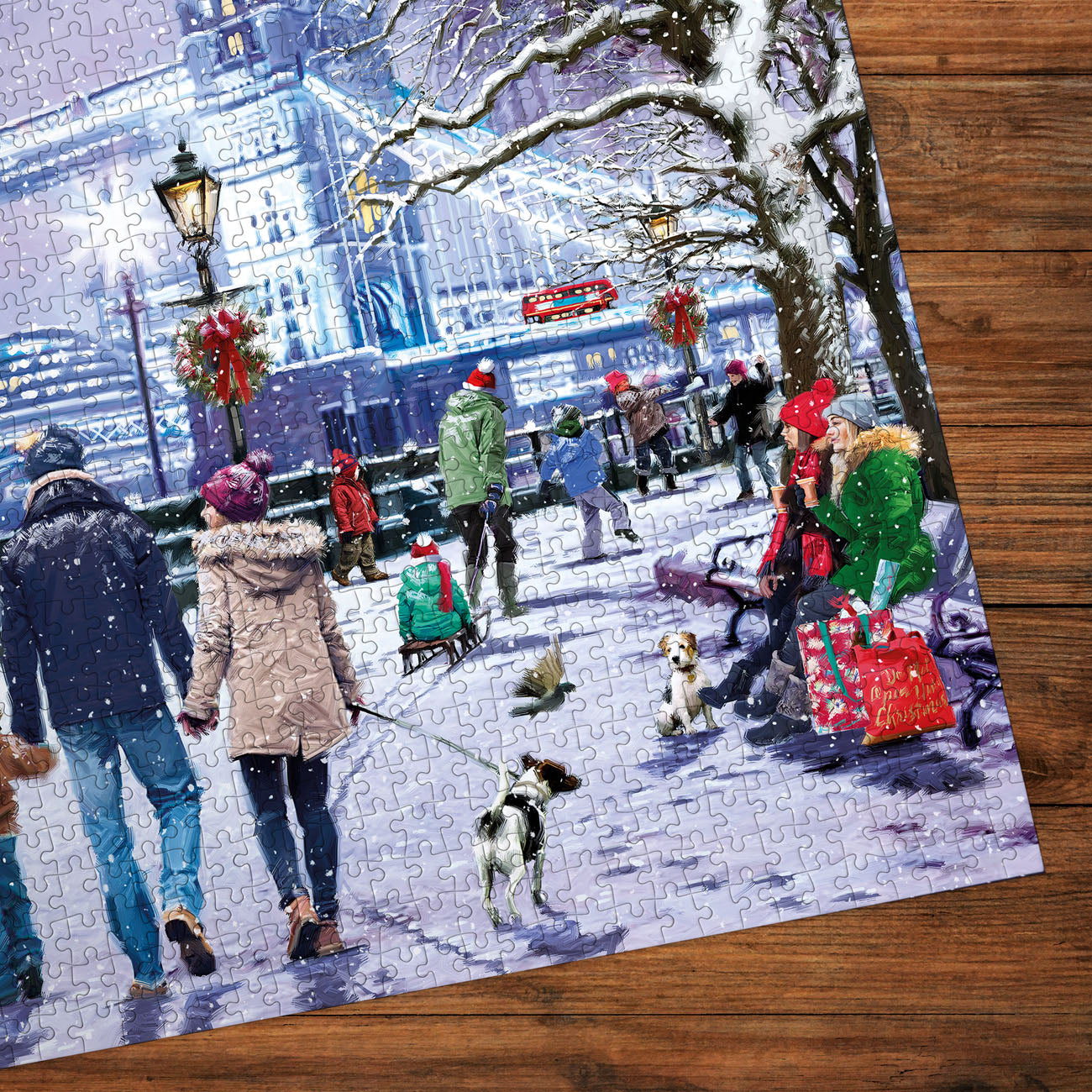 Jigsaw puzzle with a winter scene of people and dogs on a snowy street.