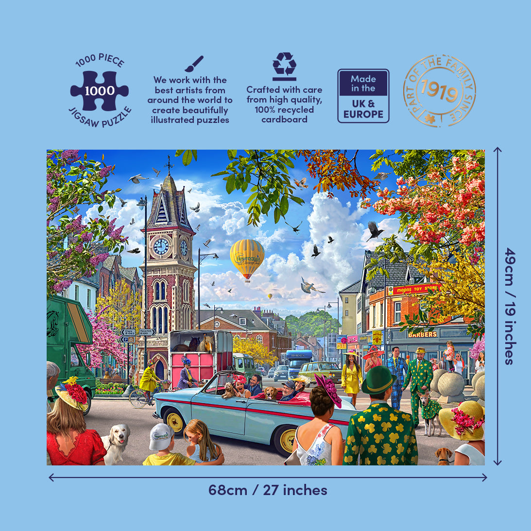 A 1000-piece jigsaw puzzle box featuring a colourful illustrated street scene with a clock tower, vintage cars, people, and trees. The box is shown on a light blue background with size markings of 68cm / 27 inches by 43cm / 19 inches and product feature icons at the top.