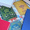 Jigsaw puzzles of classic books with colorful book covers and illustrations.