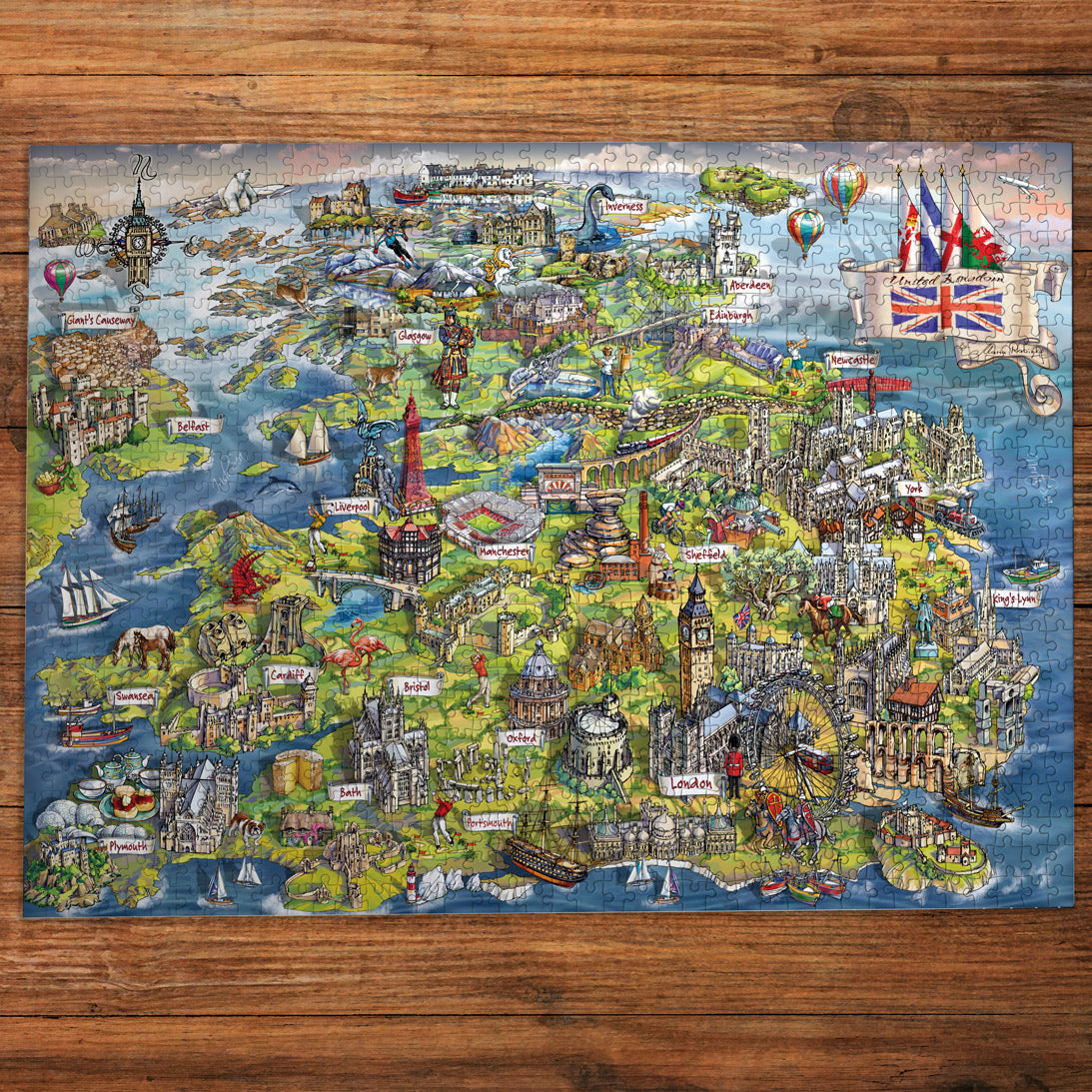 Colorful map of London with landmarks on a wooden surface