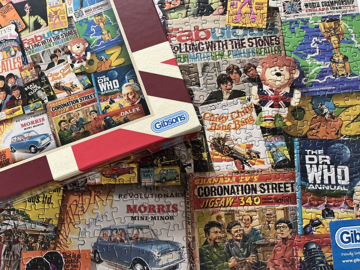 Collection of vintage-style jigsaw puzzles with colorful graphics and Gibsons branding