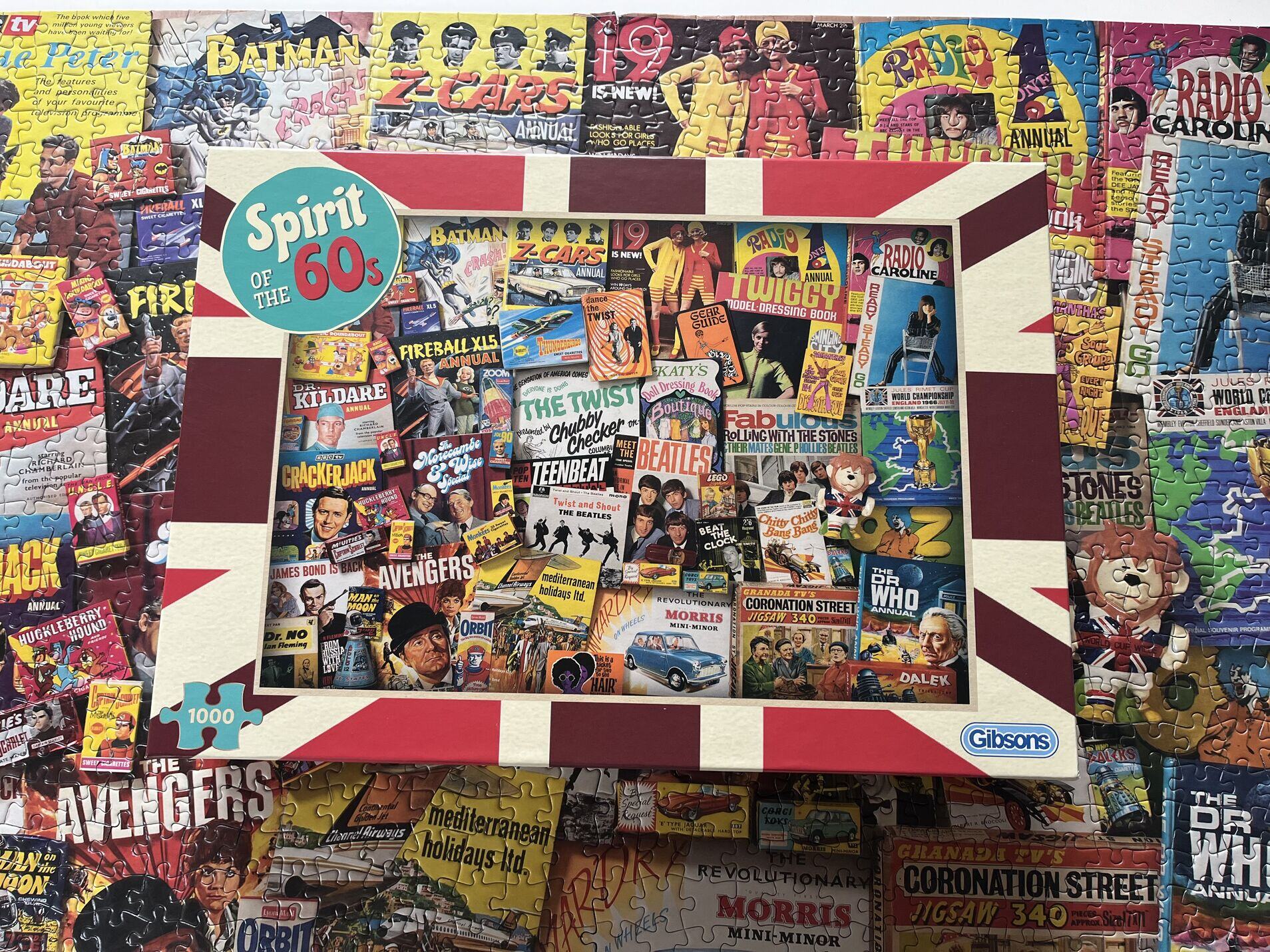 Gibson puzzle box with retro comic book covers on a colorful background