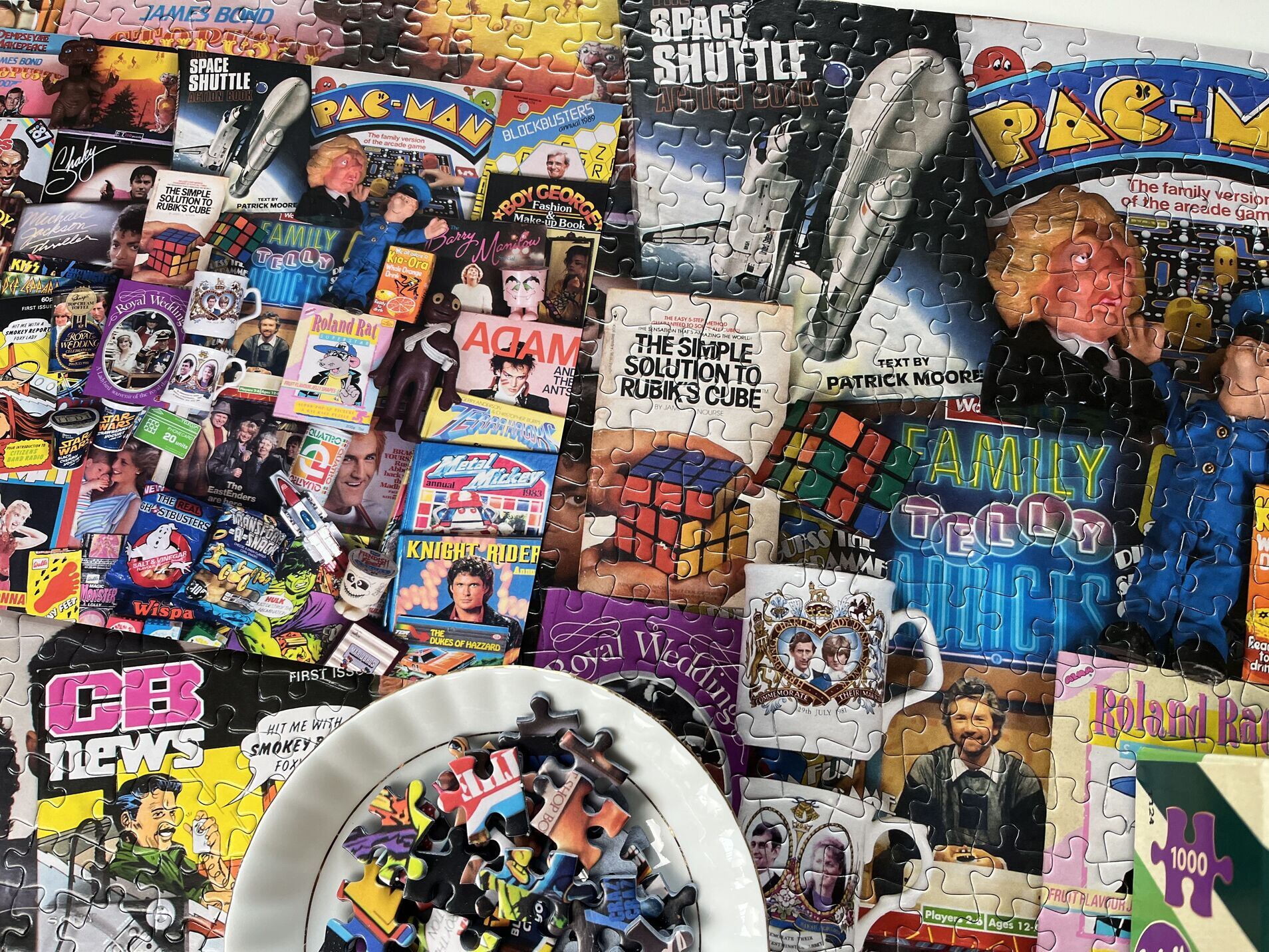 Collection of vintage puzzle boxes with various graphics and text.