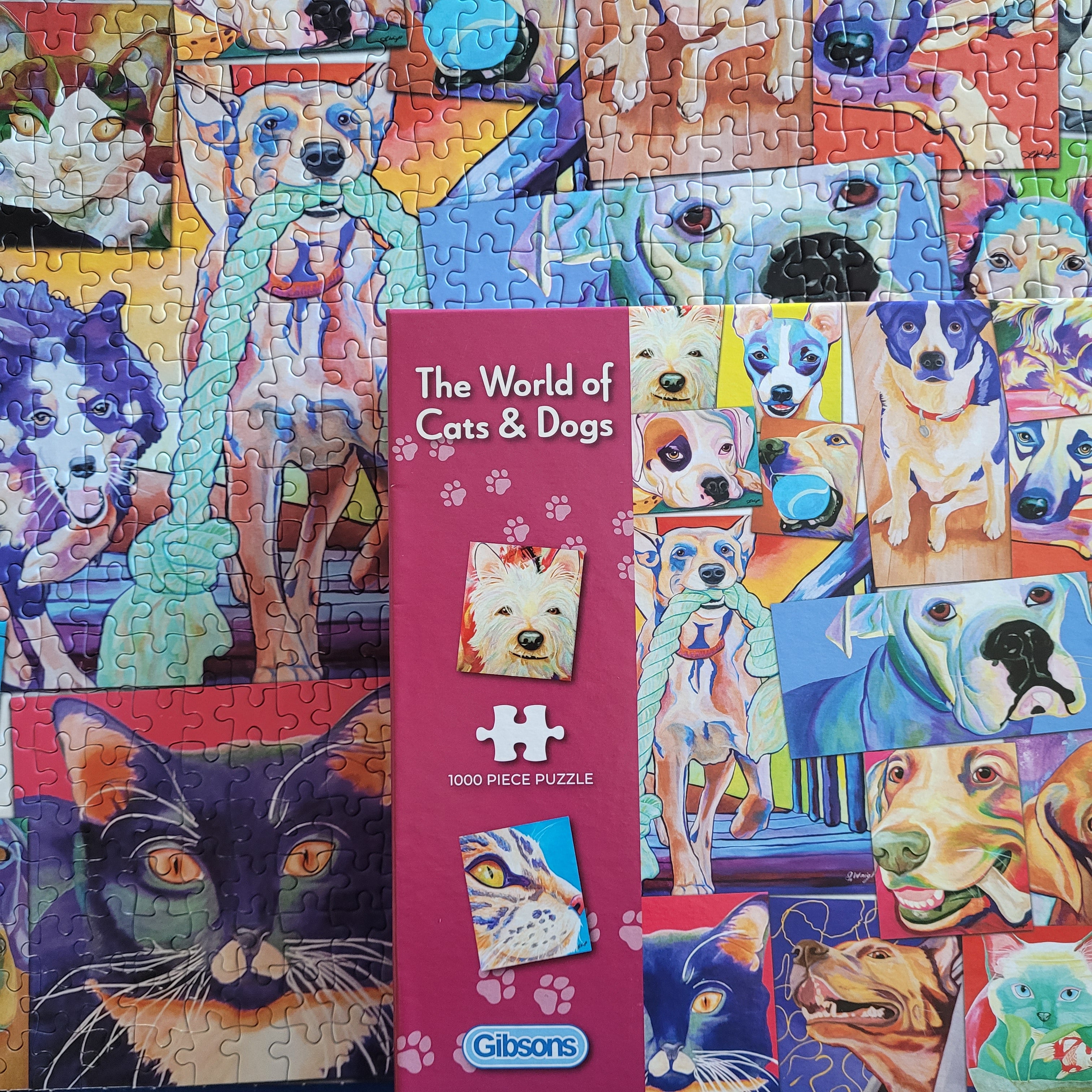 Gibson's 'The World of Cats & Dogs' puzzle with a partially completed puzzle and box.