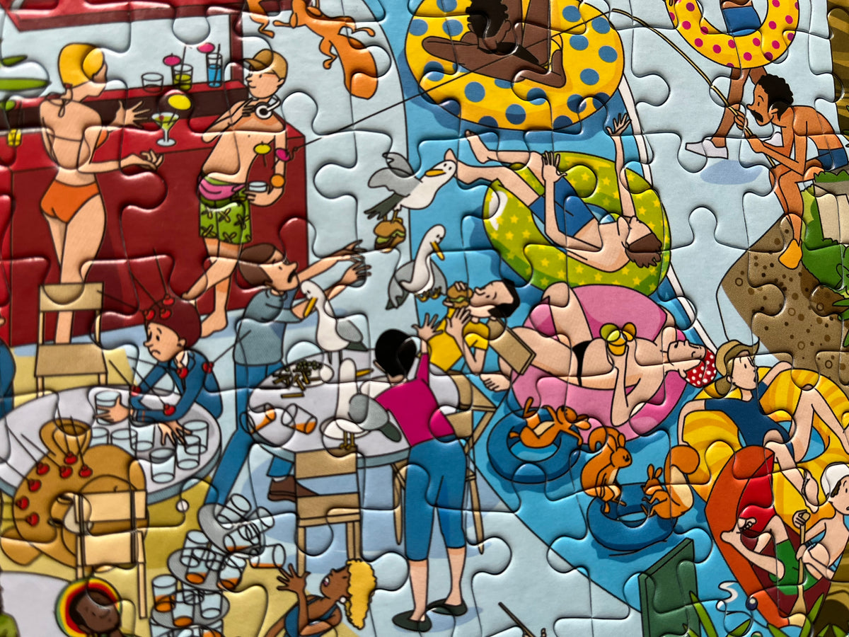 Colorful jigsaw puzzle with a beach scene featuring people in swimsuits and a bar.