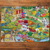 Jokesaws Campsite Capers 1000 Piece Jigsaw Puzzle by Gibsons made up on wooden table