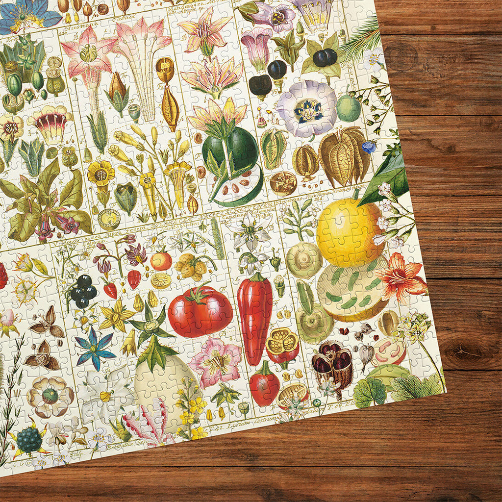 RHS Botanical Bliss 1000 Piece Jigsaw Puzzle by Gibsons made up cropped on wooden table