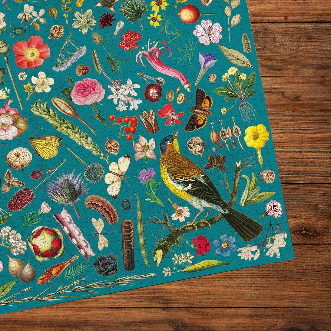 RHS Floral Fantasy 1000 Piece Jigsaw Puzzle by Gibsons made up cropped on wooden table
