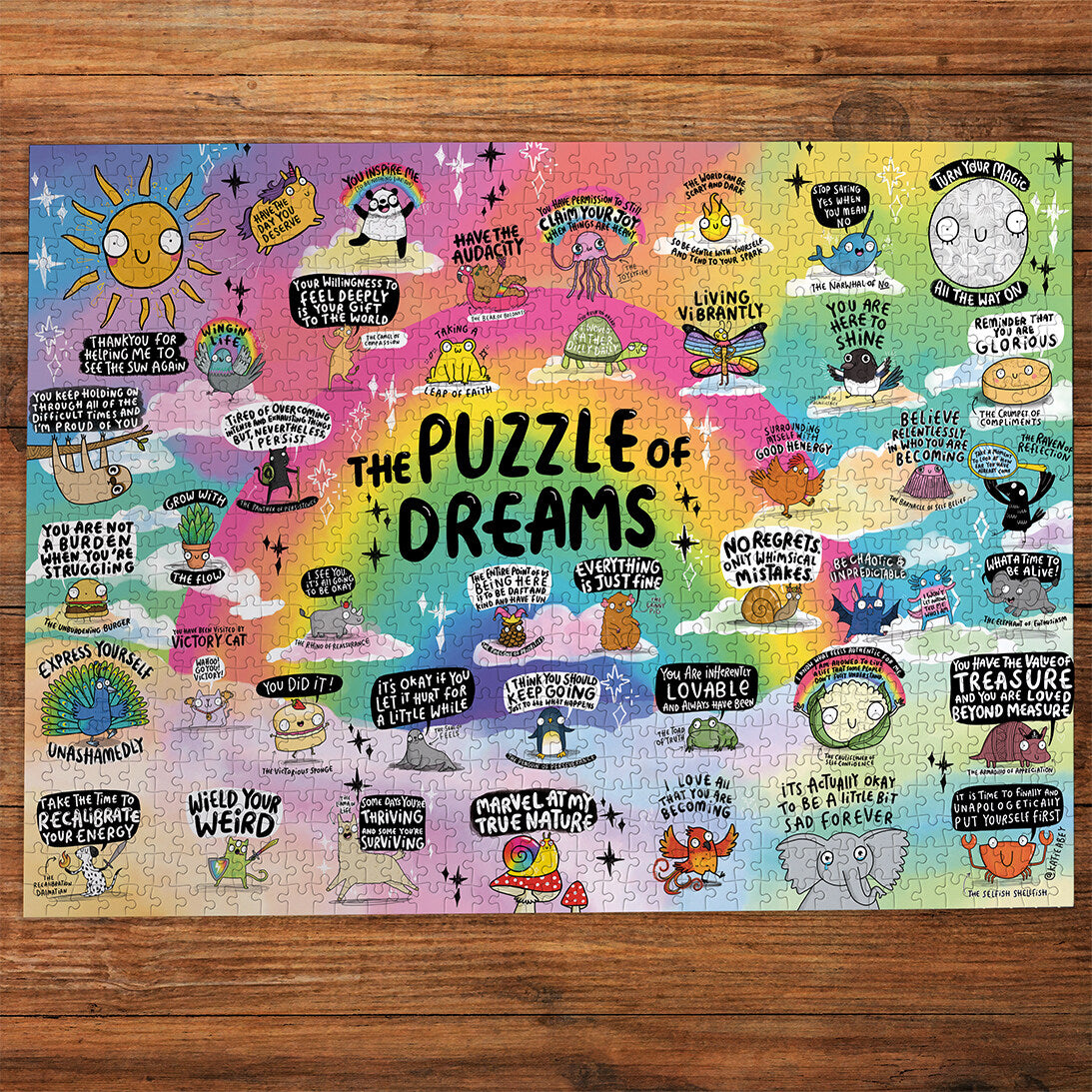 The Puzzle of Dreams 1000 Piece Jigsaw Puzzle by Gibsons made up on wooden table