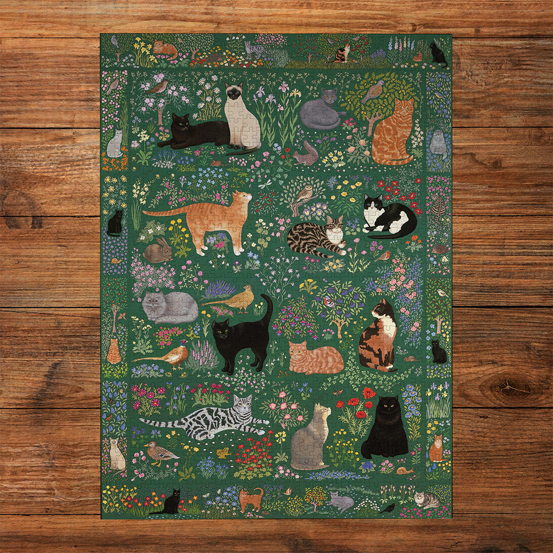 Tapestry Garden 1000 Piece Jigsaw Puzzle by Gibsons made up on wooden table