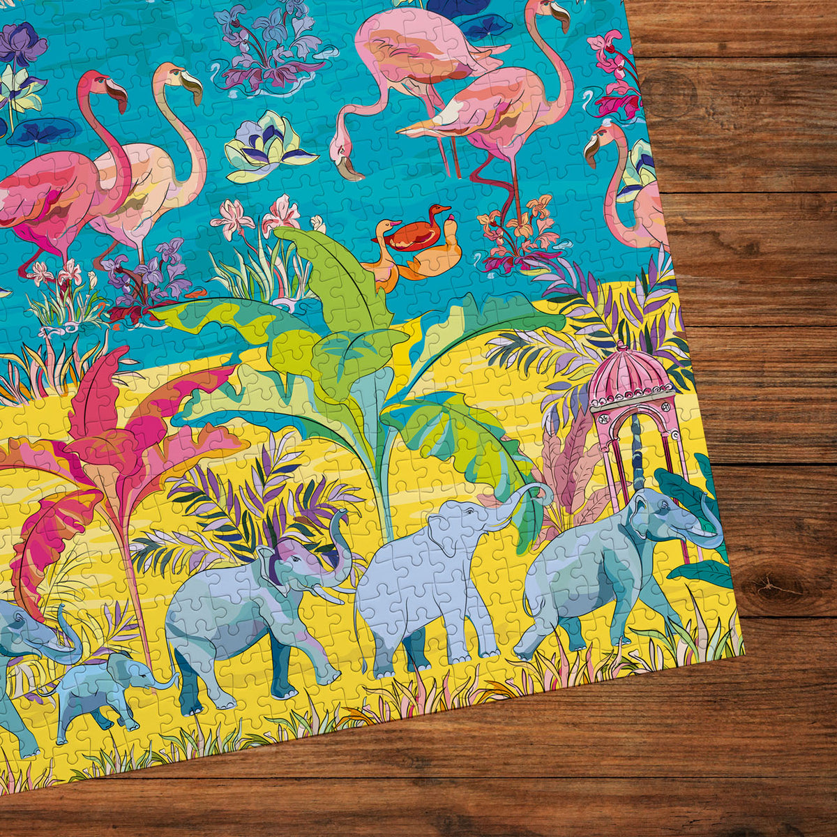 Jigsaw puzzle with colourful design of animals in a tropical setting on wooden background