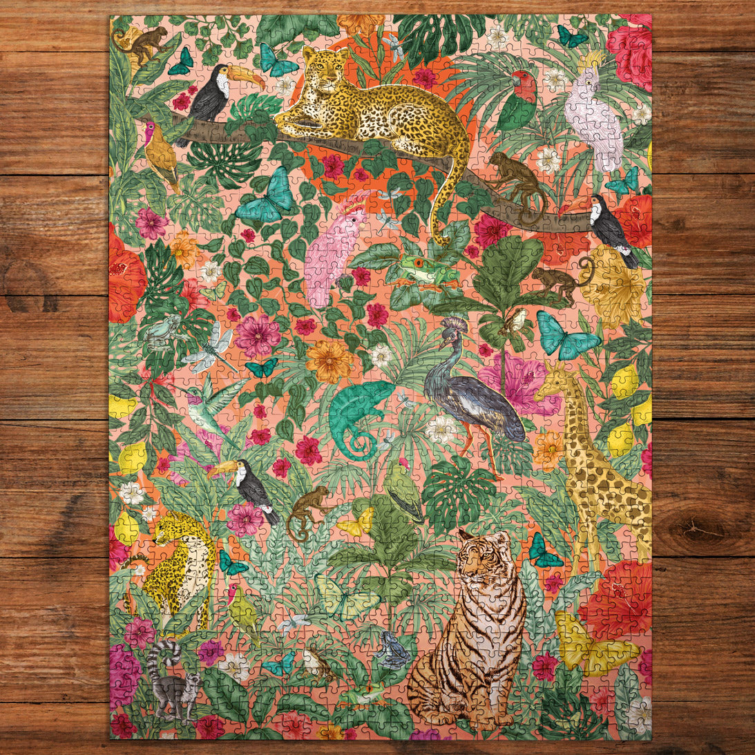 Colorful animal and floral patterned jigsaw puzzle on a wooden surface
