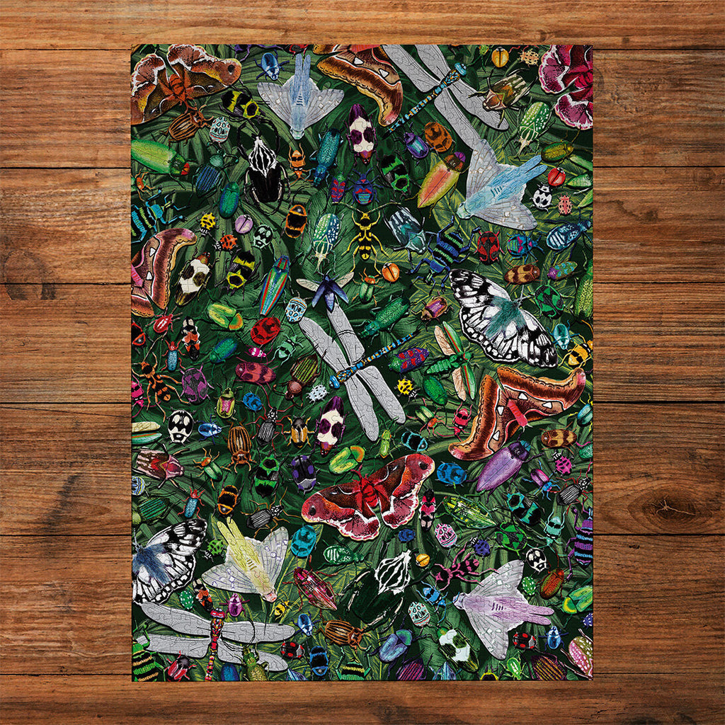 The Art File Winged Wonders 1000 Piece Jigsaw Puzzle by Gibsons made up on wooden table