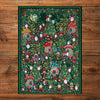 Gibsons The Art File: Christmas Village 1000 Piece Jigsaw Puzzle made up on wooden table