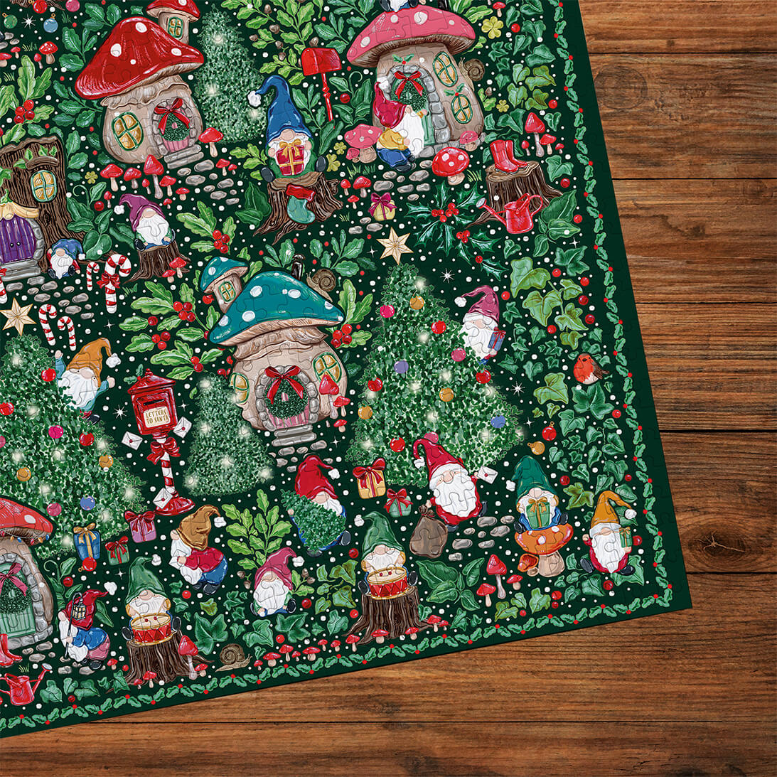 Gibsons The Art File: Christmas Village 1000 Piece Jigsaw Puzzle made up corner on wooden table