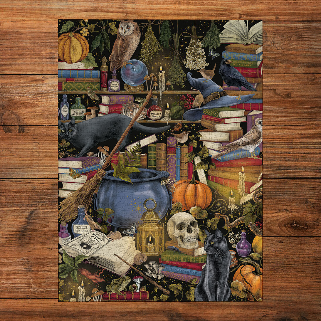 Gibsons The Art File Witchcraft 1000 Piece Halloween Spooky Jigsaw Puzzle for Adults made up on wooden table