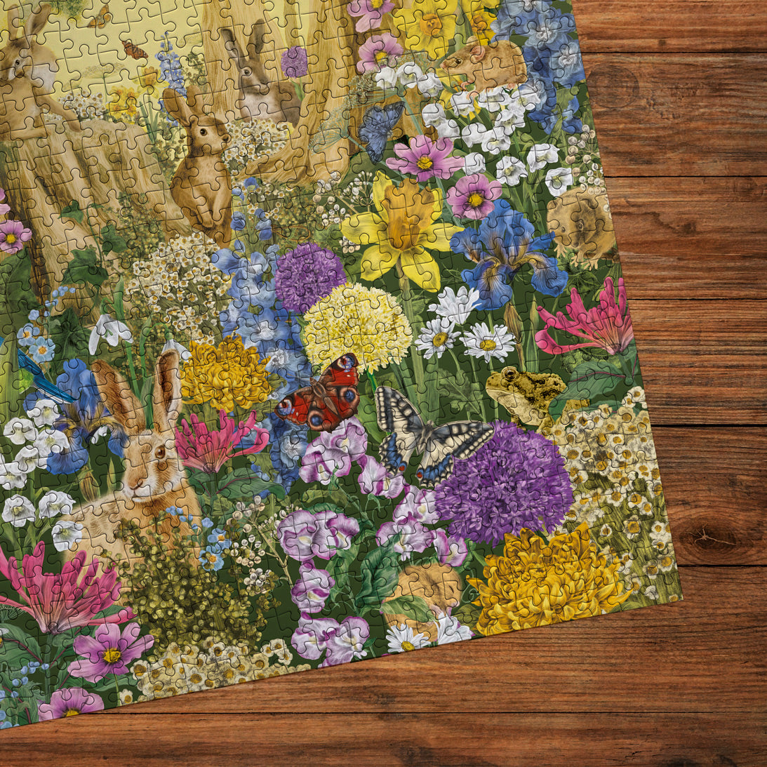 Jigsaw puzzle with rabbits and flowers on a wooden surface