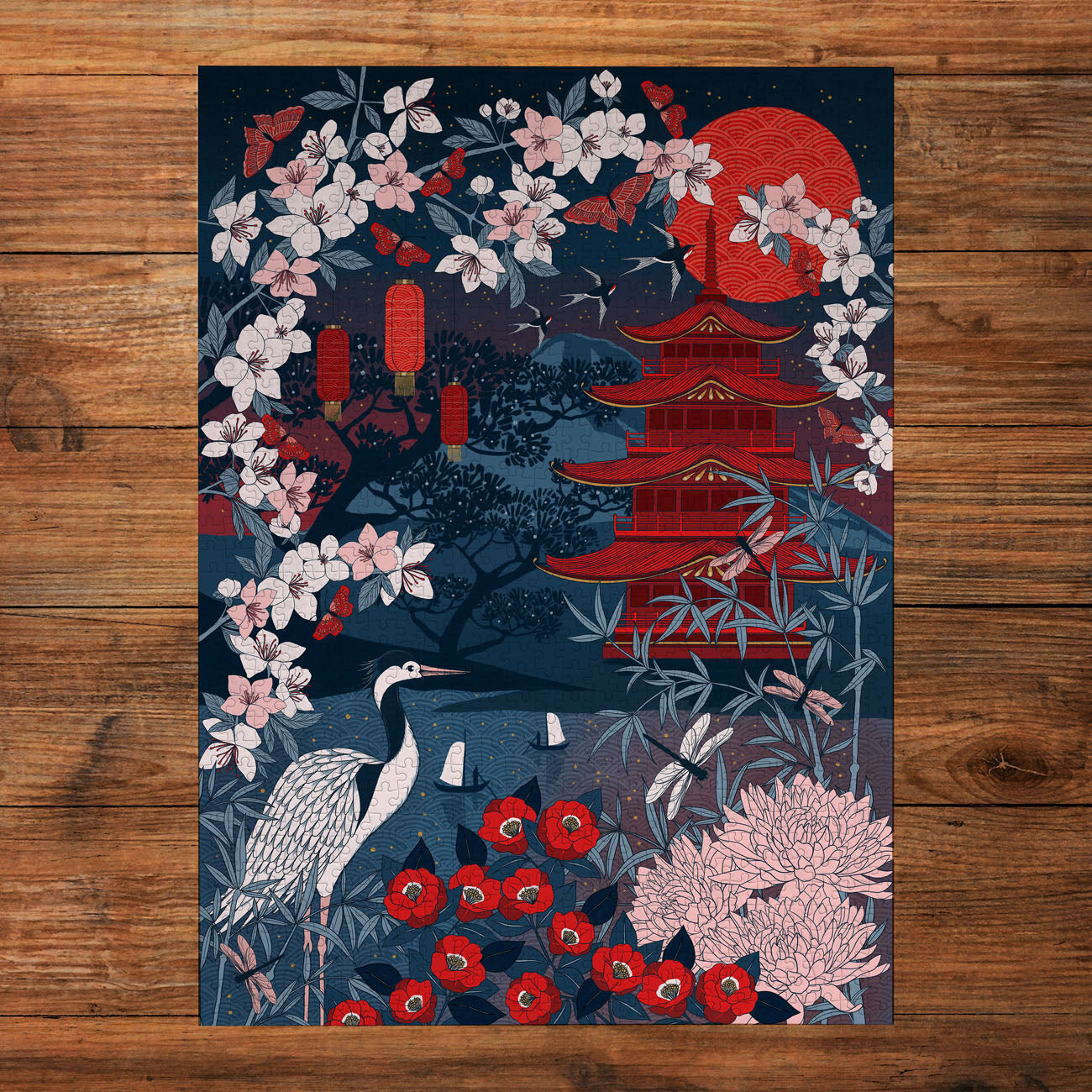 Decorative poster with Japanese-inspired design featuring a pagoda, flowers, and a crane on a wooden surface.