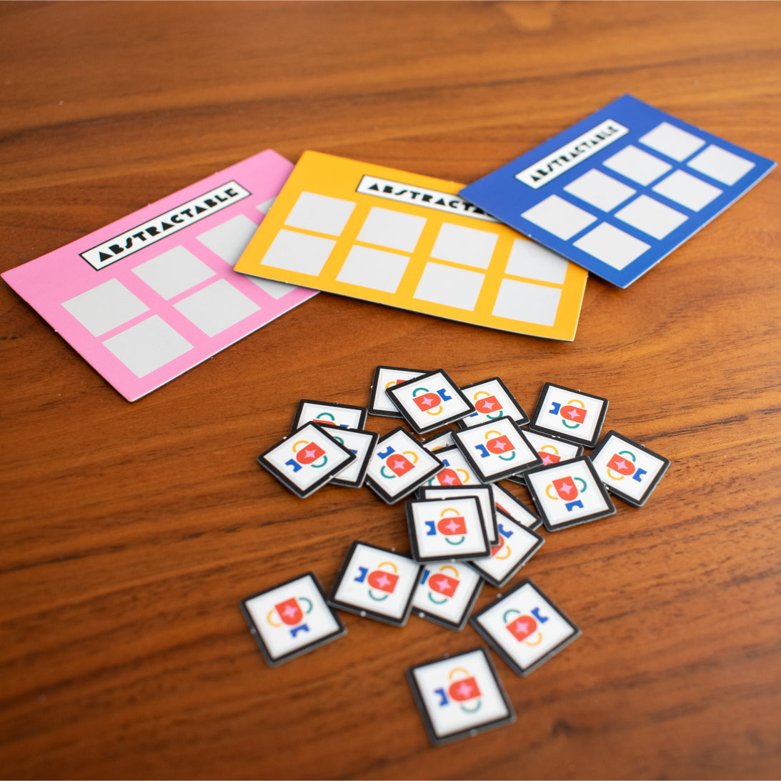 Colorful card templates and matching icons on a wooden surface