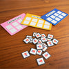 Colorful card templates and matching icons on a wooden surface