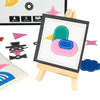 Colorful duck-shaped object on a white board with a wooden easel, surrounded by geometric shapes and game pieces.