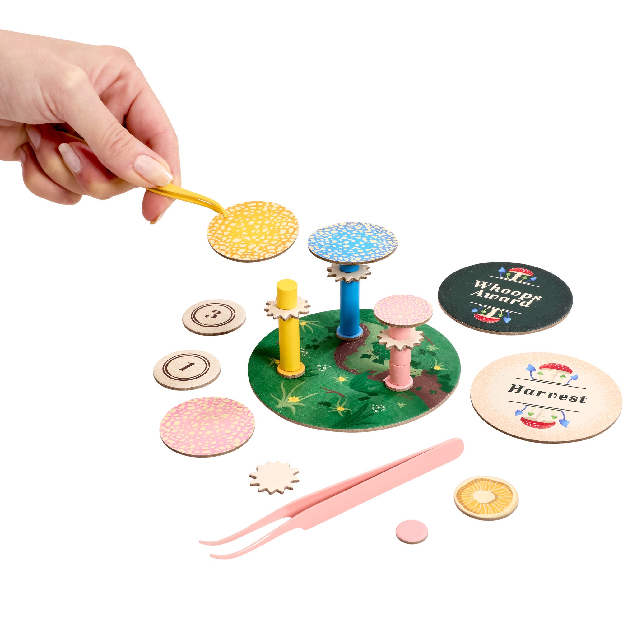 Colourful children's game with various components on a white background
