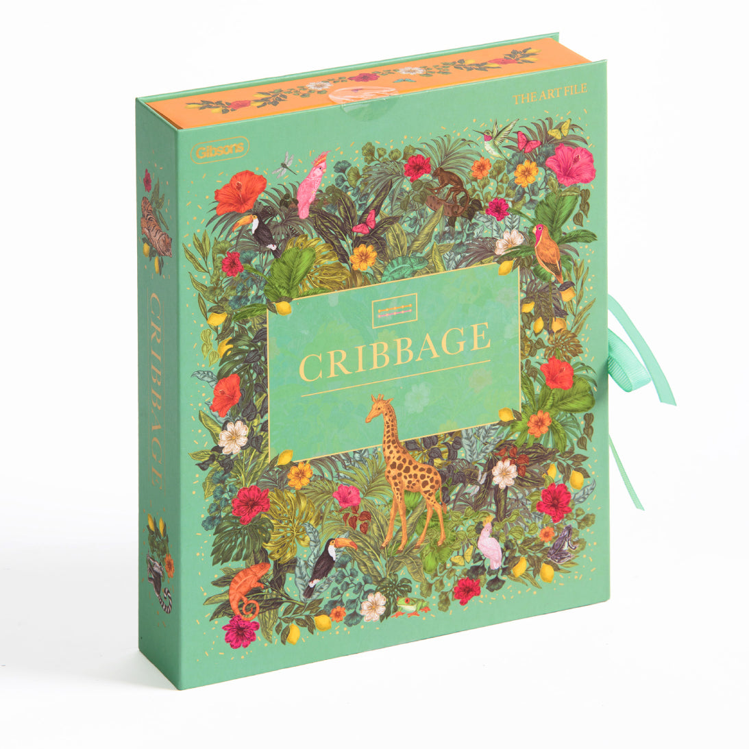A decorative hardcover game titled 'CRIBBAGE' with a lush tropical jungle illustration featuring animals and flowers. The cover is mint green with a central gold-bordered label and a small giraffe illustration.