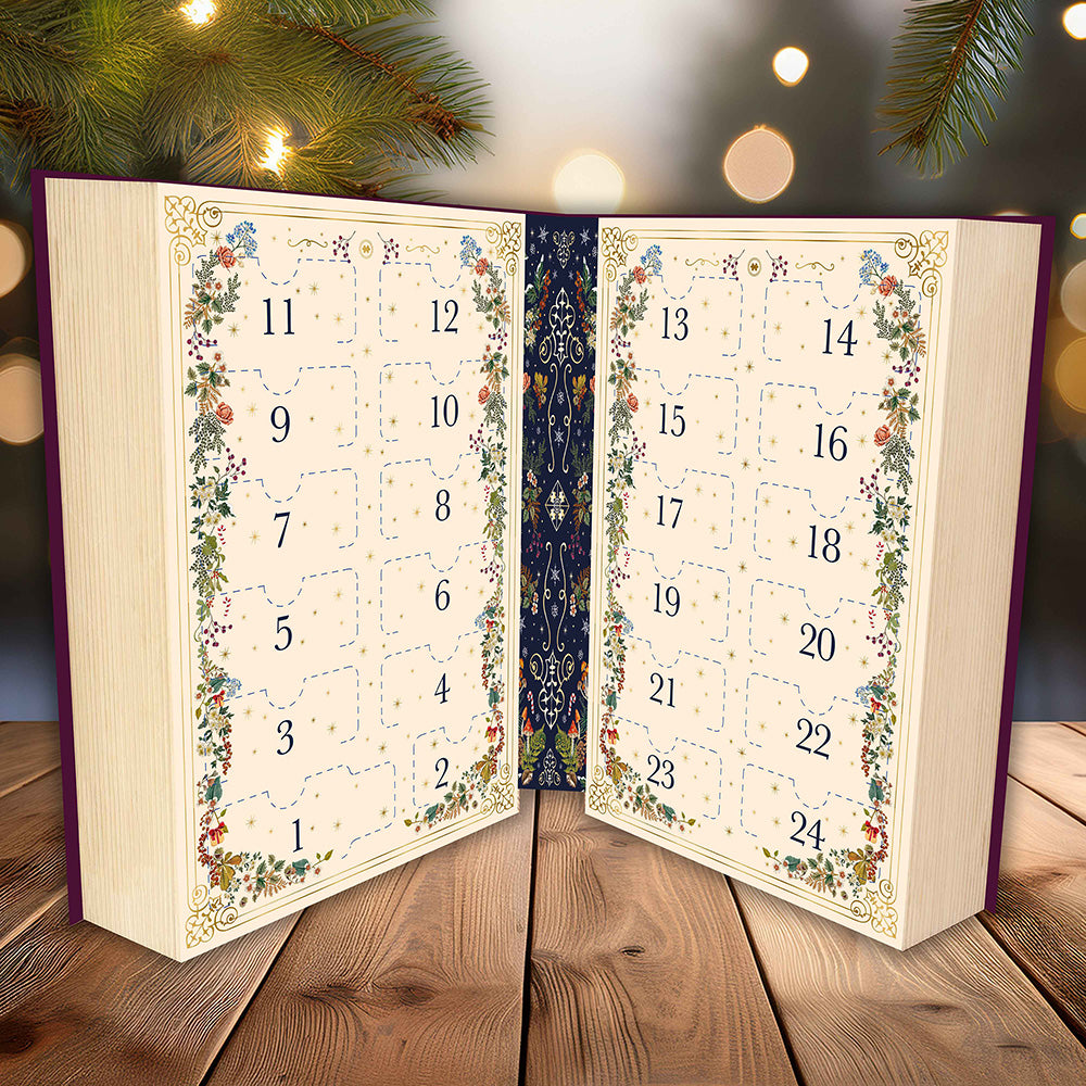 Advent calendar shaped like an open book with decorative pages on a wooden surface.